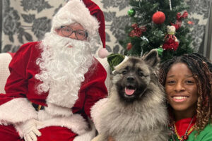 pup with Santa Claus and his elf